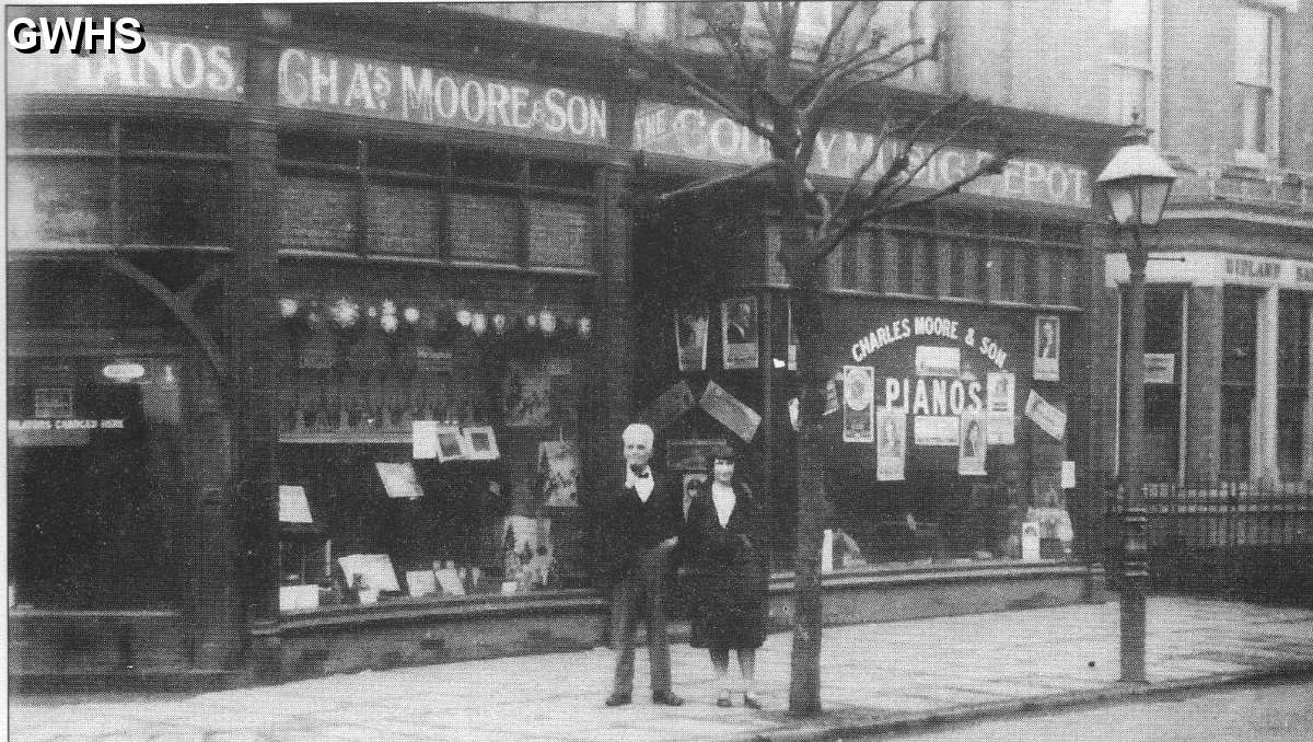 22-127 Charles Moore and Kathleen Veasey circa 1929 outside Chas Moore Music Shop on corner of Blaby Road and Canal Street 