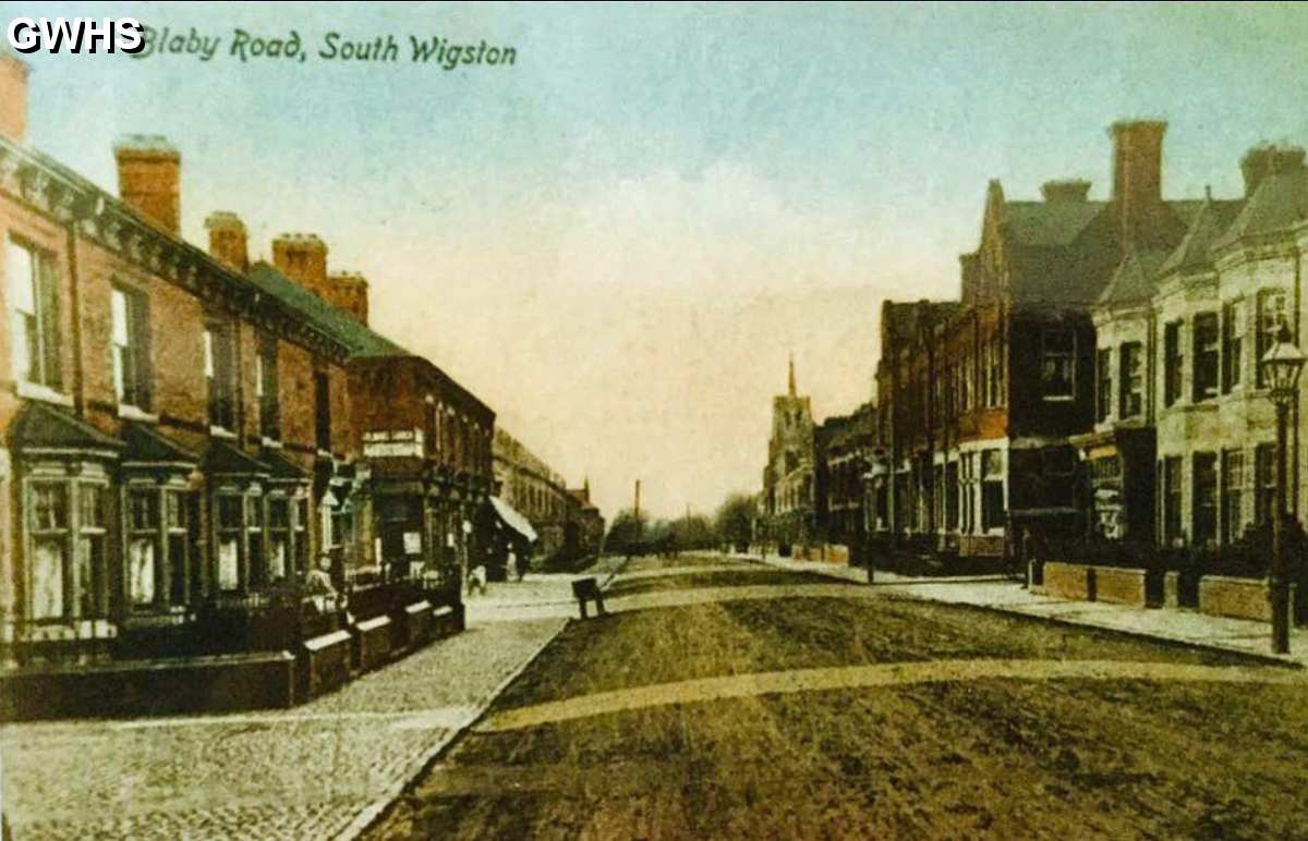34-321 An early postcard of South Wigston cannot see the Ritz Cinema and the coop just out of view where the cobbles go in on the left hand side of the pic