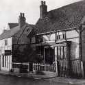 8-93a Sam Laundons Saddlers Shop Bull Head Street Wigston Magna and old Yeomans House 1935