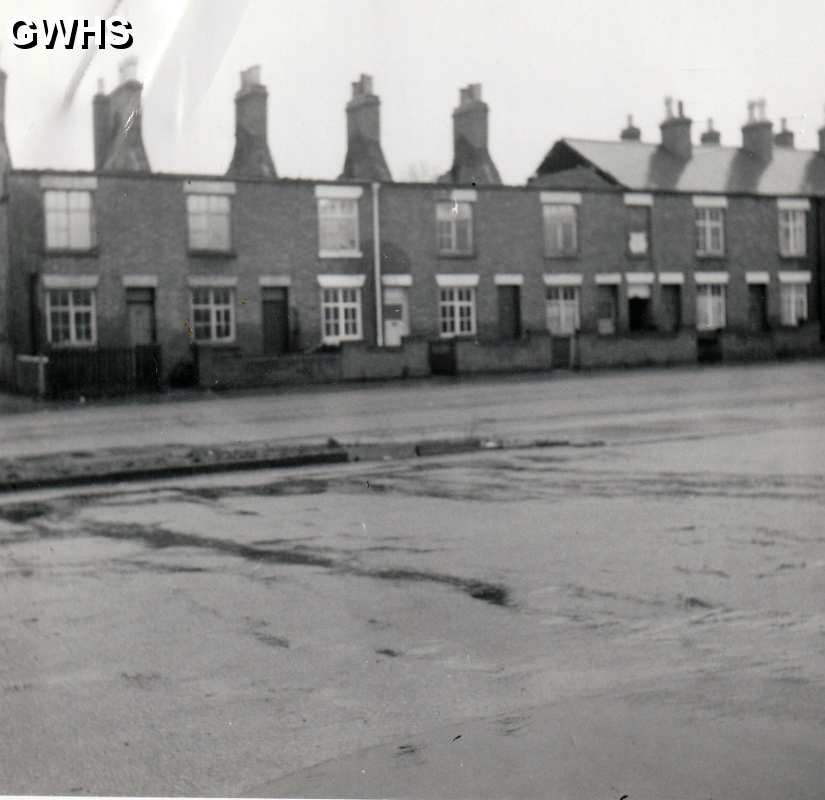 39-478 Cottages to the right of the Horse & Trumpet being demolished in Bull Head Street Wigston Magna