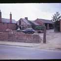 26-173 Site of the old Crucks Cottage Bull Head Street Wigston Magna with Co-op she repairers on the right circa 1960