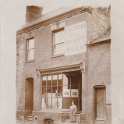 29-642 18 Bushloe End Wigston Magna Emma Bates nee Holt outside her shop c 1940