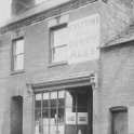29-642a 18 Bushloe End Wigston Magna Emma Bates nee Holt outside her shop c 1940