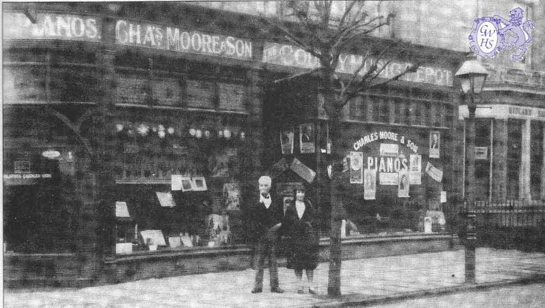 22-127 Charles Moore and Kathleen Veasey circa 1929 outside Chas Moore Music Shop on corner of Blaby Road and Canal Street 