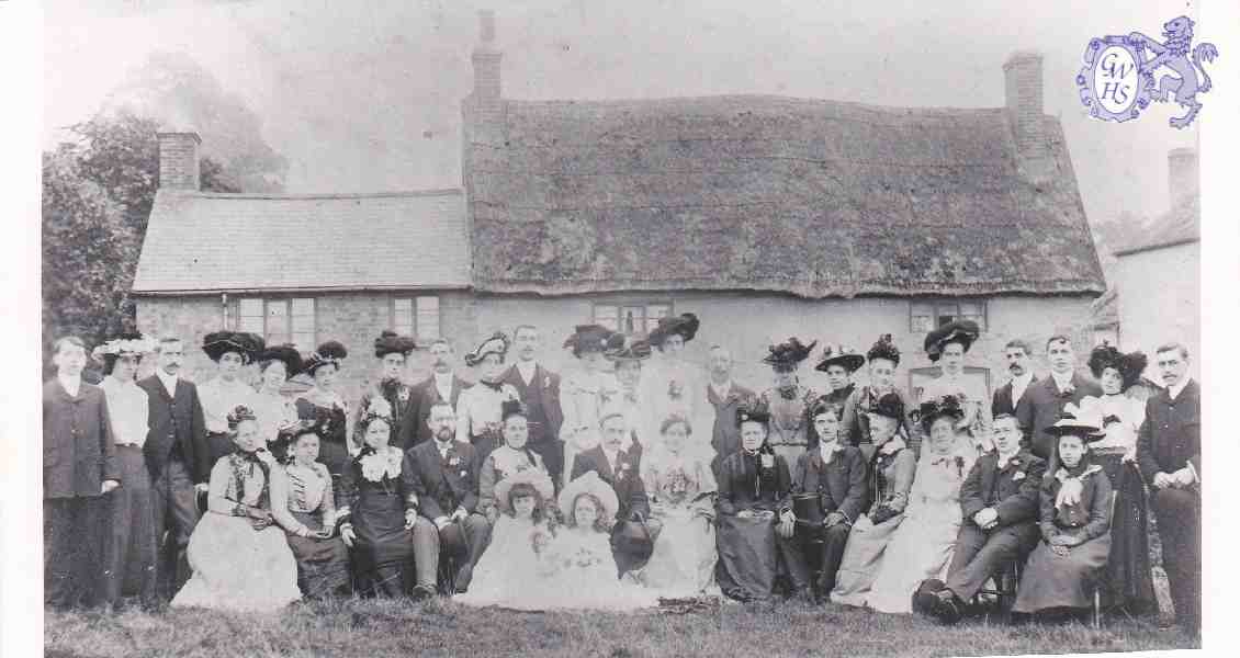 8-72 Butcher Johnsons fathers wedding outside old cottages on Bull Head Street Wigston Magna