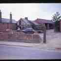 26-173 Site of the old Crucks Cottage Bull Head Street Wigston Magna with Co-op she repairers on the right circa 1960