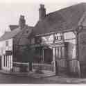 8-93 Sam Laundons Saddlers Shop Bull Head Street Wigston Magna and old Yeomans House 1935