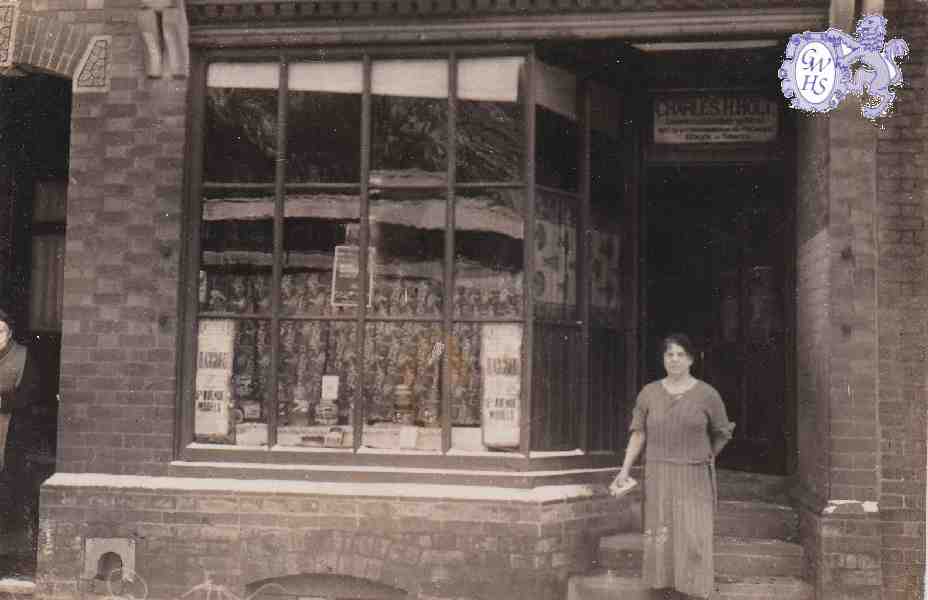 29-113 Shop of Charles H Hold 18 Bushloe End Wigston Magna with Emma Holt nee Bates in shop doorway c 1940