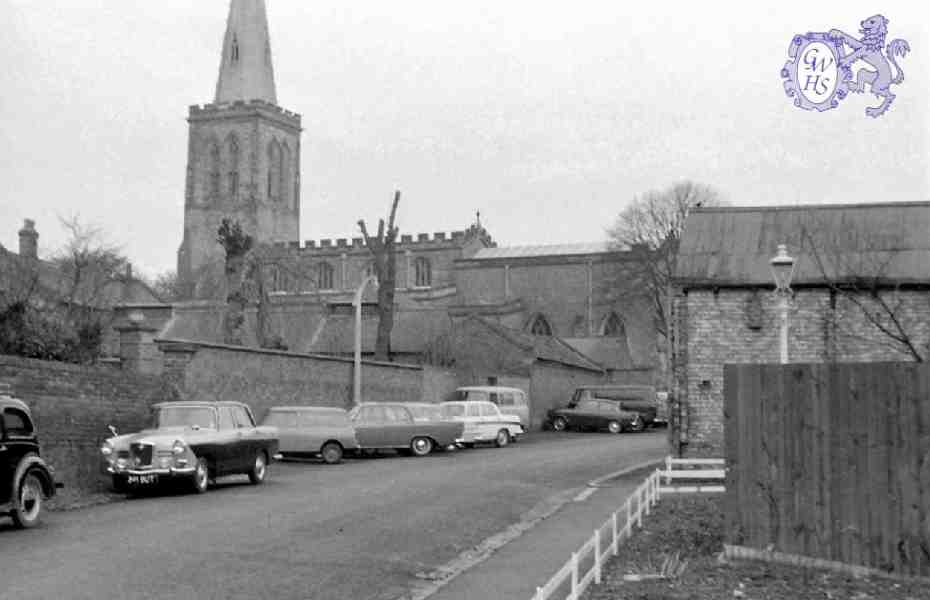 30-766 All Saints' church showing the outbuildings for Rectory Farm 1963