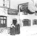 23-014 Plough Inn Bushloe End - Joseph Potter in doorway 