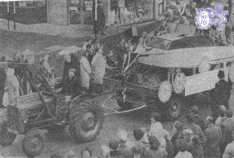 21-013 Rotary Club float -Rotary Floatary- with Duncan Lucas driving the tractor c 1965