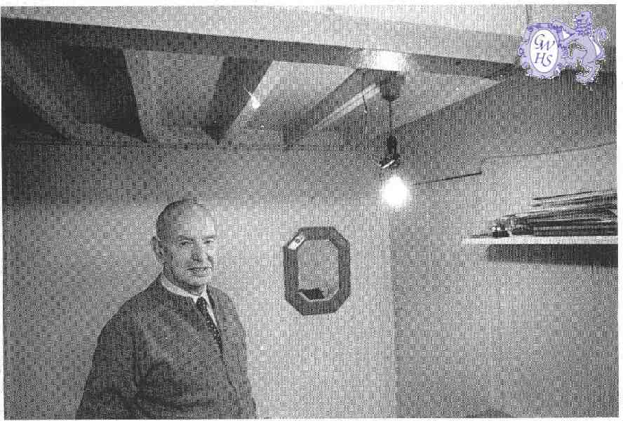 22-225 Hubert Hall in back room of his cycle, wireless and TV shop in Long Street  Wigston Magna