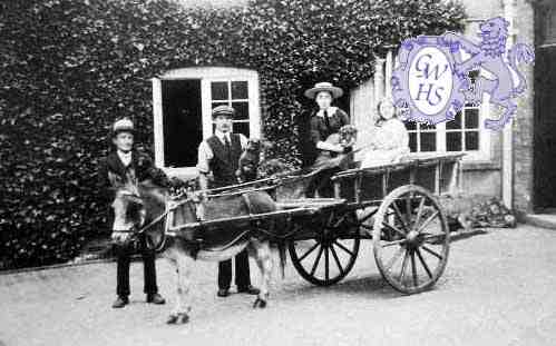 7-104 The Rolleston Family at Glen Parva Grange 1905 Clarice Clover and Dorothy Wright in the cart with John Wright holding the donkey