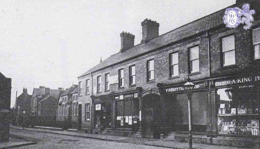 32-420 Four Businesses at the end of Long Street Wigston Magna c 1920