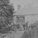 22-516a Rev Thomas Cope Deeming and wife in garden of the Manse Long street Wigston Magna circa 1902