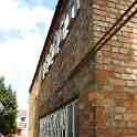 23-078 Side alley way by building in Barrack Yard with Moat Street Wigston Magna in the background April 2013