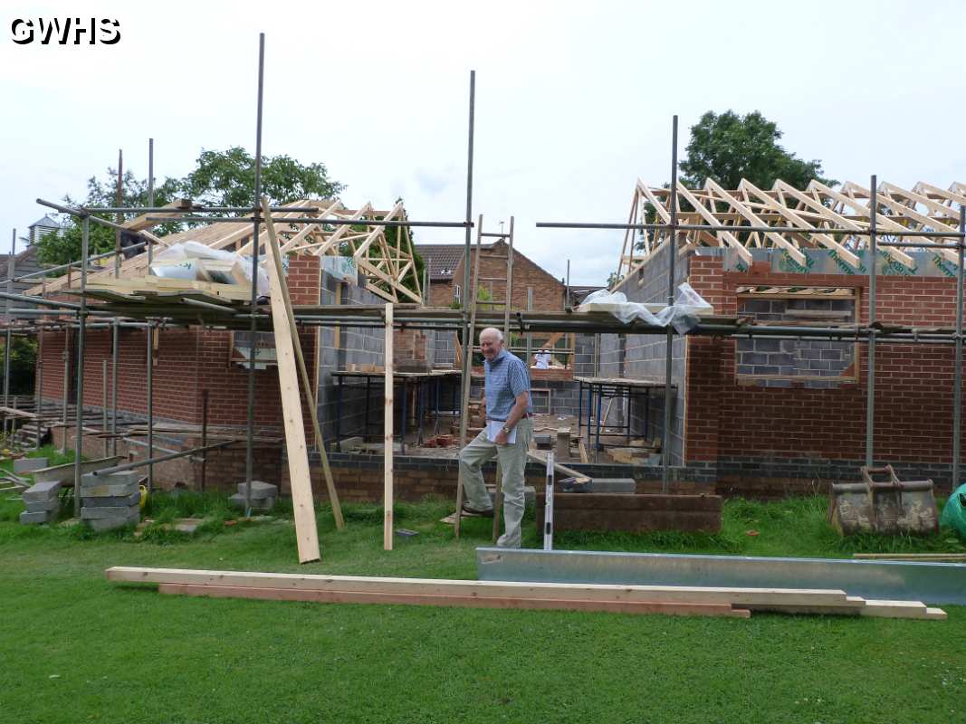 22-006 Duncan Lucas outside his new bungalow on Newton Lane - under construction in summer 2012