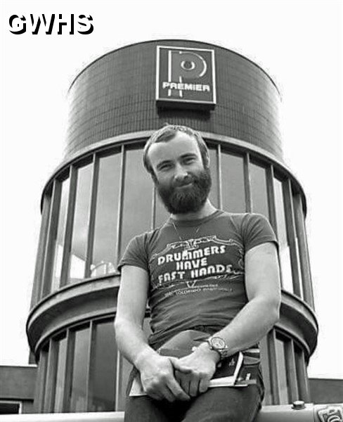 33-274 Phil Collins outside Premier drum many moons ago