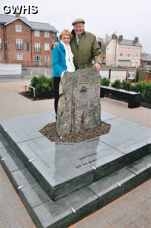29-108 Jean & Duncan Lucas in front of memorial stone in Bell Street Wigston Magna 2014