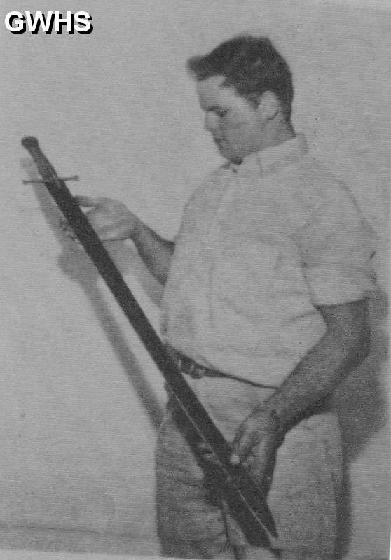 19-208 Peter Wilford with a sword he unearthed in his fathers garden