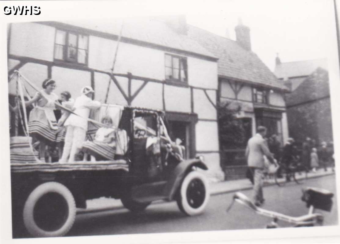 9-57 Carnival with Quaker House Bull Head Street Wigston Magna in the backgoround