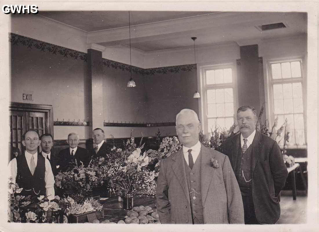30-466 George Broughton far left taken at flower show in the Long Street building board room