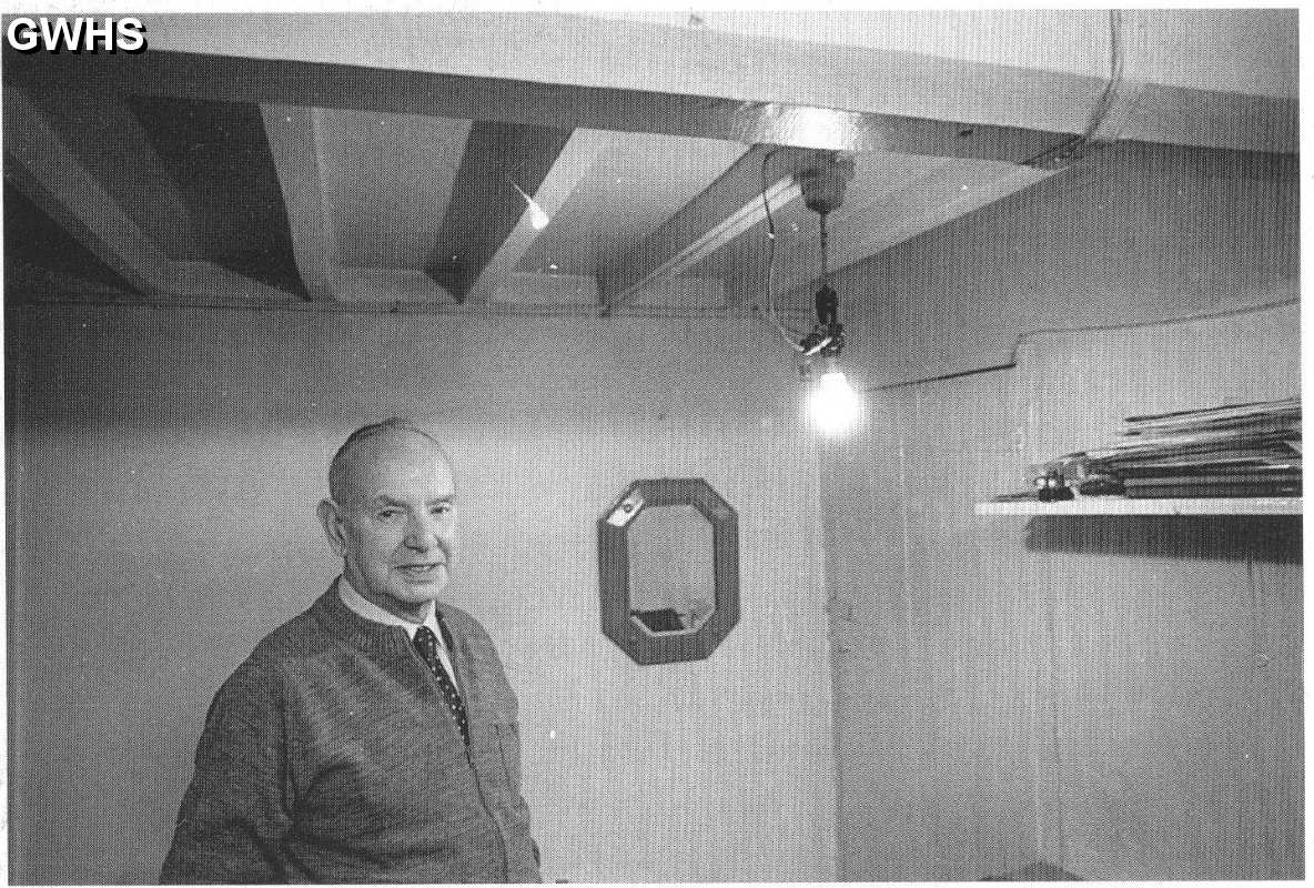 22-225 Hubert Hall in back room of his cycle, wireless and TV shop in Long Street  Wigston Magna