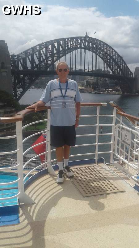 34-581 Ron Chapman on cruise ship with Sydney Harbour Bridge in background