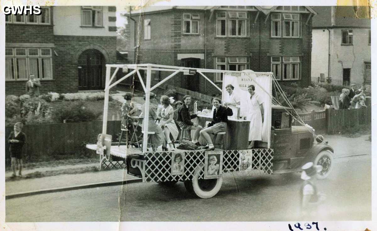34-587 This one is from 1937 and part of a parade my Mum Joyce Mawby from Central Avenue is raising a glass