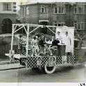 34-587 This one is from 1937 and part of a parade my Mum Joyce Mawby from Central Avenue is raising a glass