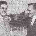 26-106 Trevor Harris being congratulated by Councilor Curtis Weston July 1949