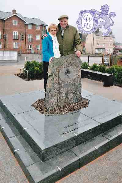 29-108 Jean & Duncan Lucas in front of memorial stone in Bell Street Wigston Magna 2014