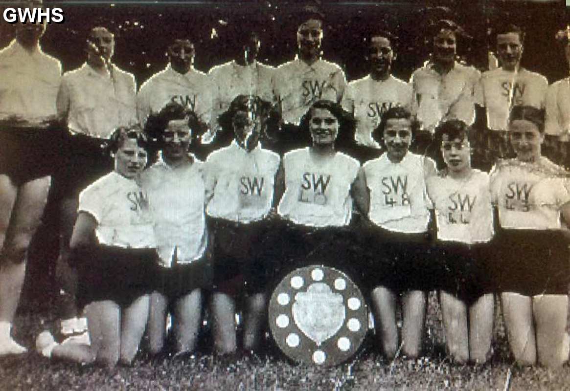 35-295 Jane Owen (dolly) number 40 and their sports team who won the shield for SWHS in 1952
