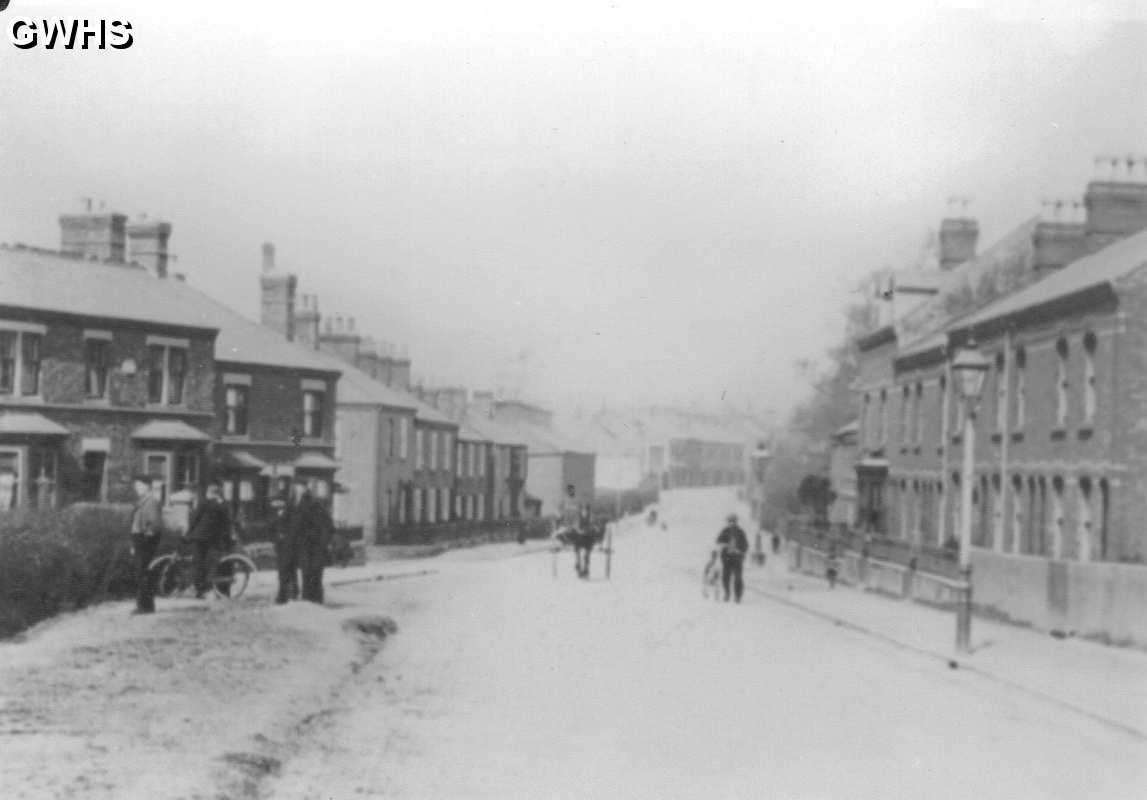 23-013 Welford Road  Wigston Magna looking north - men on left watching football 1900's