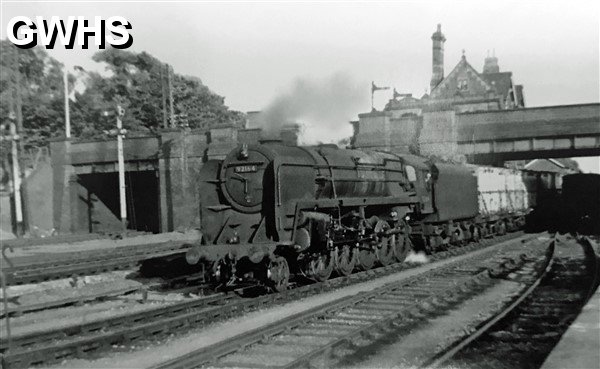 39-107 Br 2-10-0 No 92164 passing under Spion Kop Leicester bound 1962 with Wigston Magna station in the background