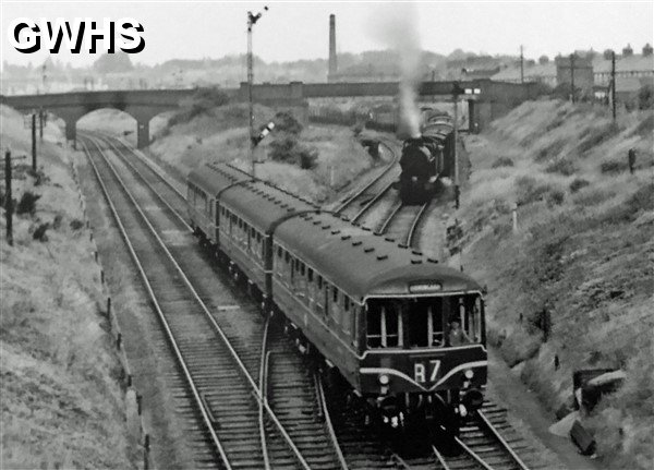 39-158 Steam hauled goods being held on the South Curce for a DMU entering Glen Parva station 1959