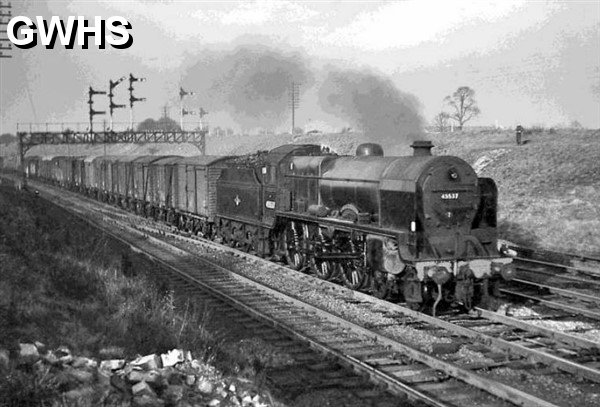 39-204 'Patriot' 4-6-0 No 45537 Private E Sykes VC passes under the gantry controlling the junction with a Nuneaton bound freight. 4 March 1961