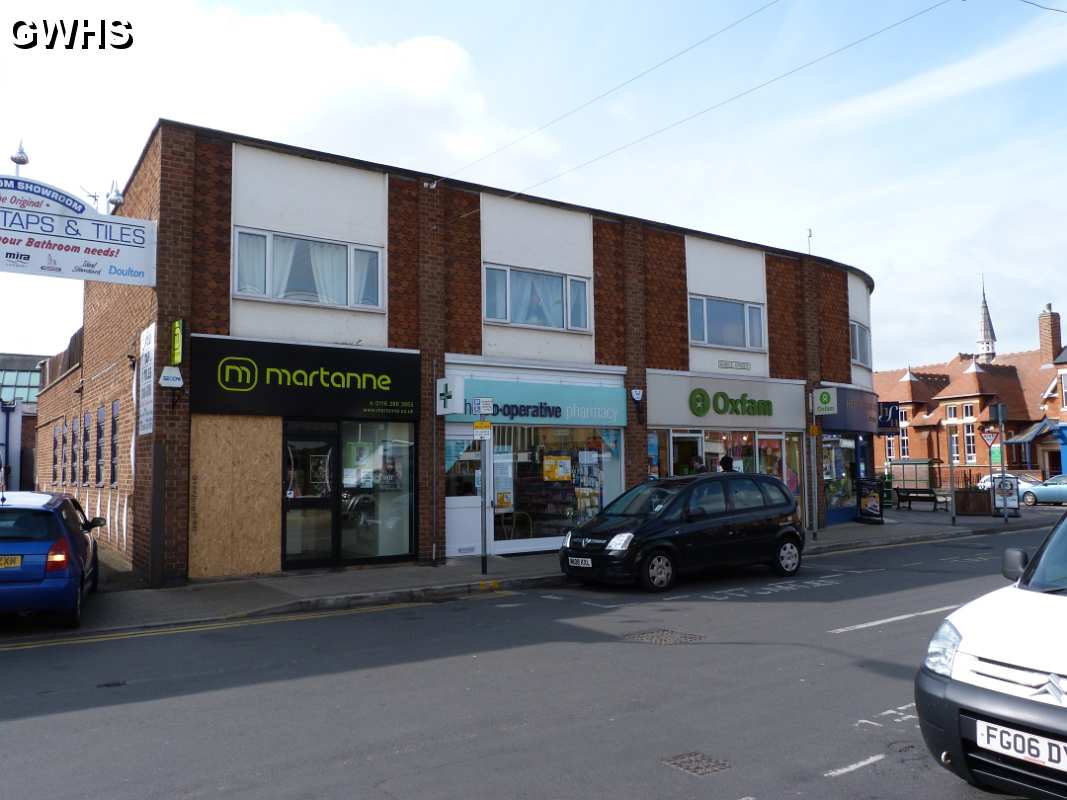 19-272 Martanne - Chemist and Oxfam Shop Bell Street  Wigston Magna April 2012