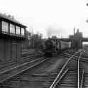 28-023 A three cylinder 4-4-0 pulls away from Wigston Magna station in the the early 1950's.  (JDS Collection)